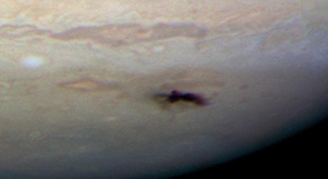 Hubble Space Telescope photo of a scar on Jupiter caused by a comet impact